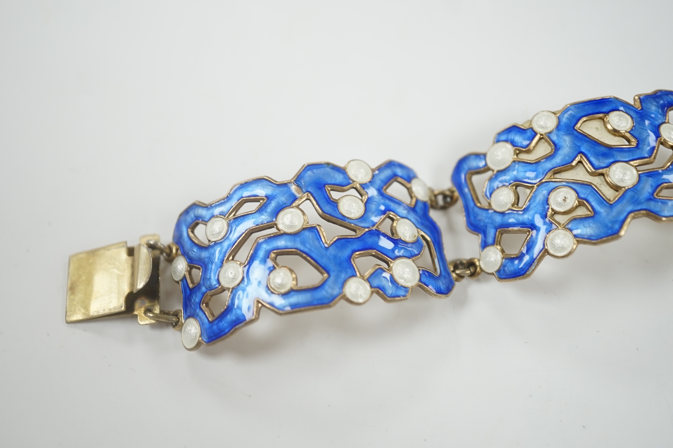 A mid 20th century Norwegian pierced gilt sterling and two colour enamel set bracelet, by Askel Holmsen, interior diameter approximately 55mm.